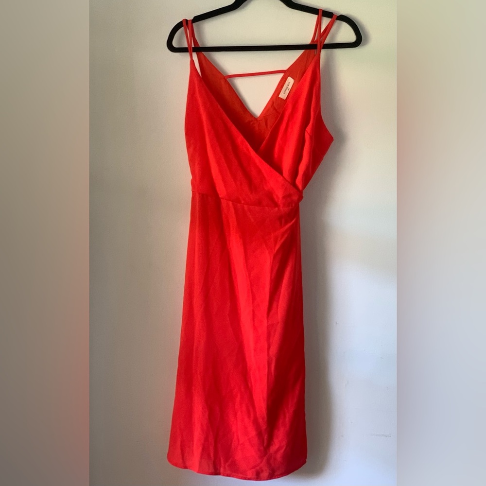 Sophie Rue, reddish orange wrap dress.